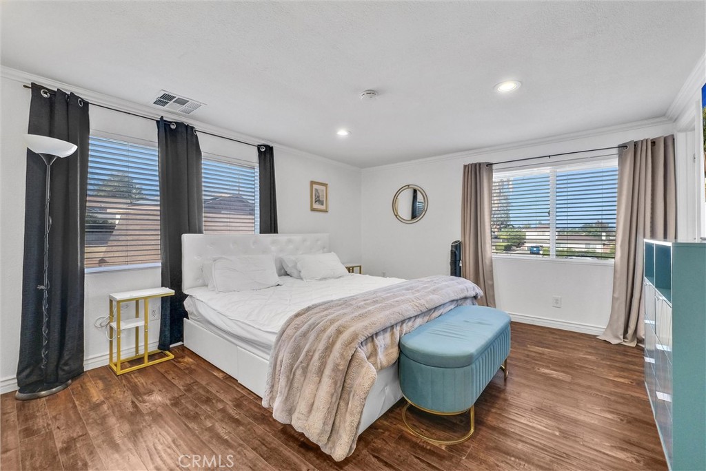 6220 Filkins Avenue Rancho Cucamonga, CA 91737 - Photo 30 of 37 a bedroom with a bed and a wooden floor