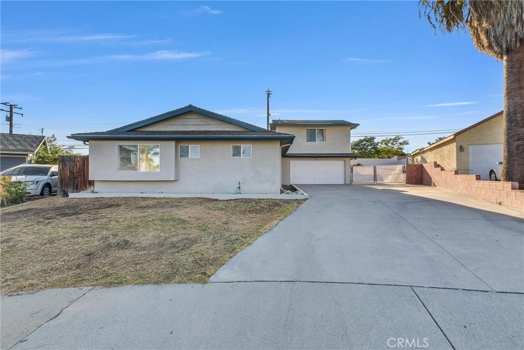 6220 Filkins Avenue Rancho Cucamonga, CA 91737 - Photo 3 of 37 a front view of a house with a yard