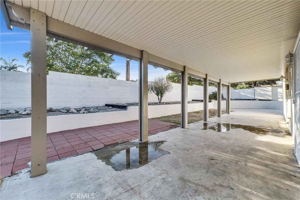 6220 Filkins Avenue Rancho Cucamonga, CA 91737 - Photo 35 of 37 a view of a porch with a floor to ceiling window