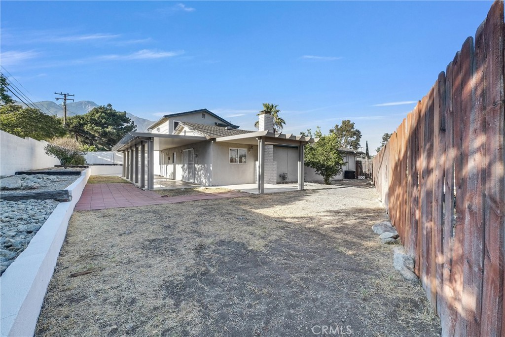 6220 Filkins Avenue Rancho Cucamonga, CA 91737 - Photo 36 of 37 a view of a house with a yard
