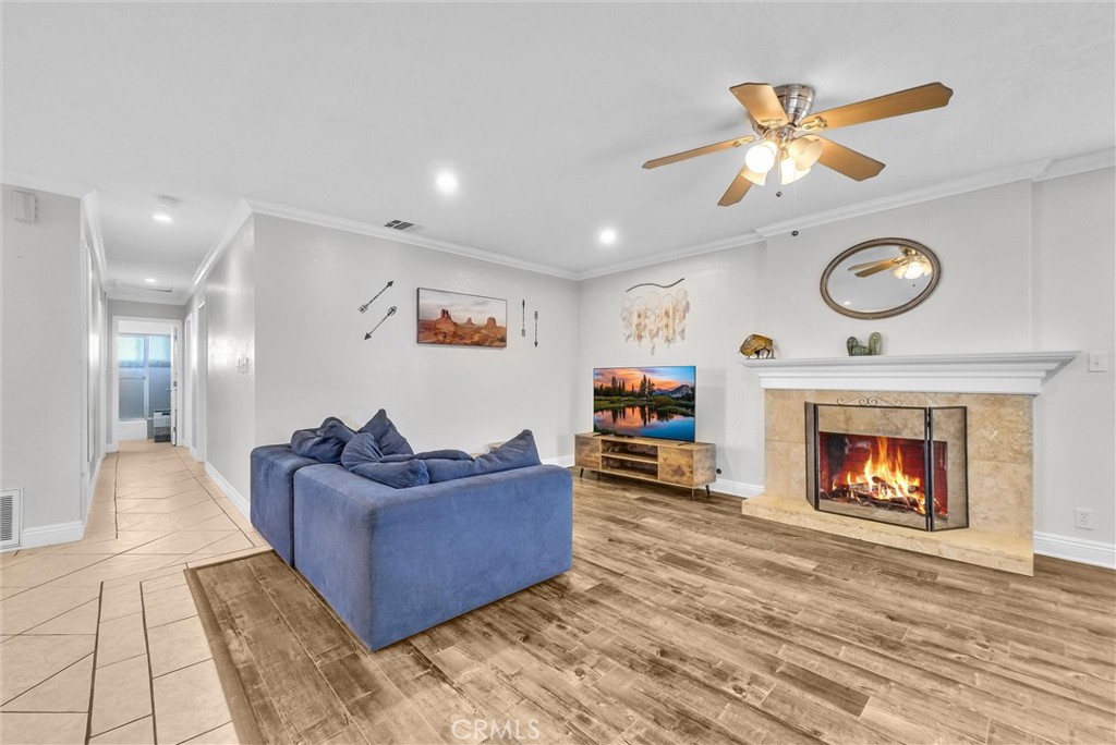 6220 Filkins Avenue Rancho Cucamonga, CA 91737 - Photo 9 of 37 a living room with furniture and a fireplace