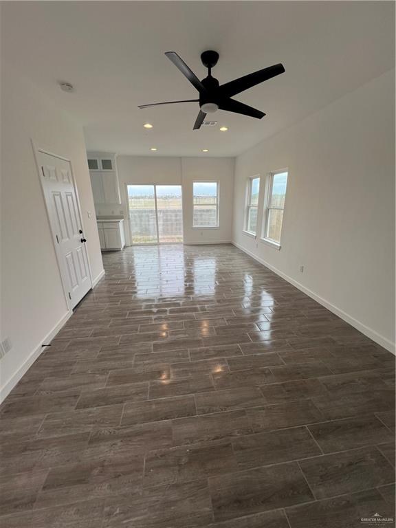 1624 West B Street Mission, TX 78572 - Photo 2 of 10 Livingroom featuring recessed lighting, dark wood finished floors, baseboards, and ceiling fan