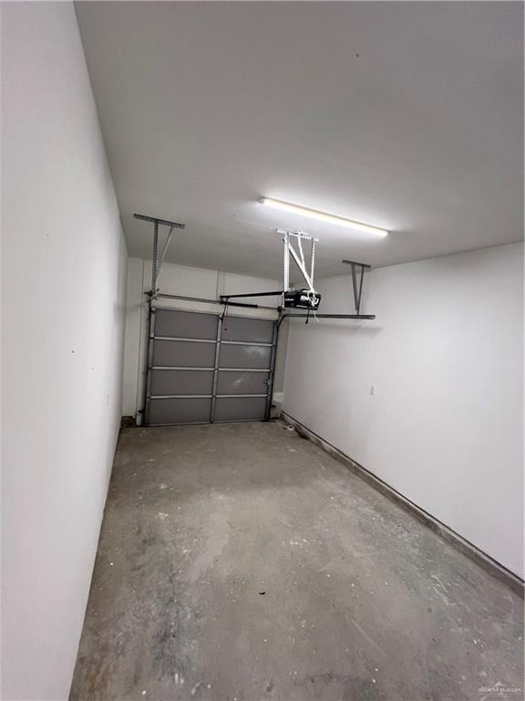 1624 West B Street Mission, TX 78572 - Photo 10 of 10 Garage featuring a garage door opener