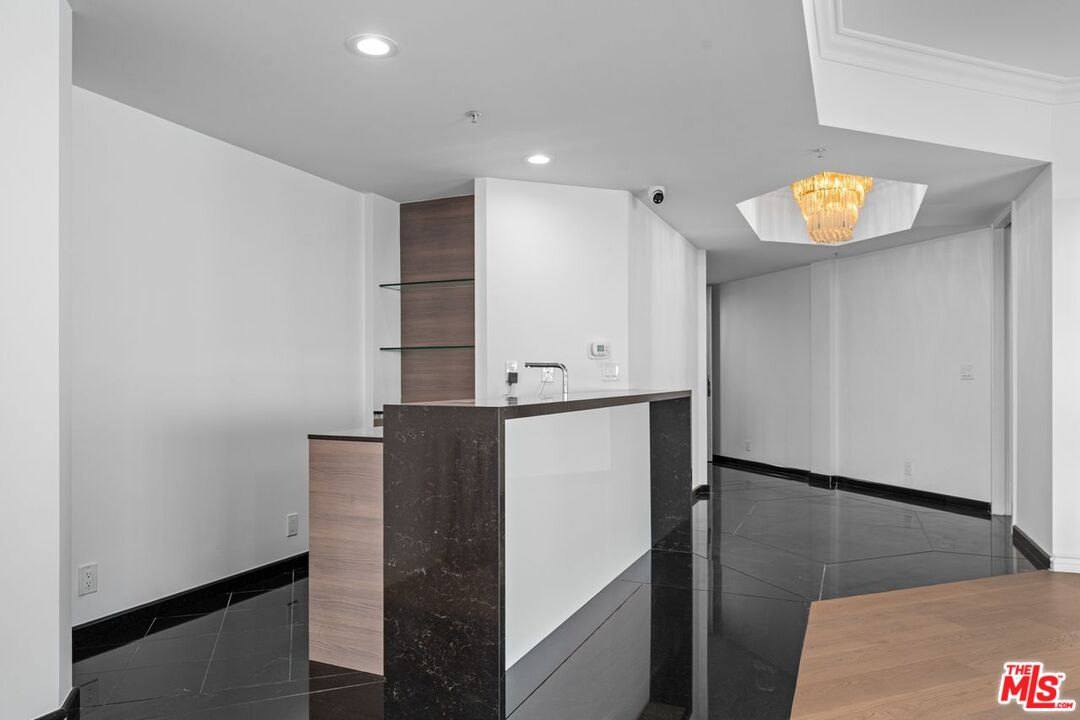 10490 Wilshire Boulevard, Unit 1004 Los Angeles, CA 90024 - Photo 13 of 45 a bathroom with a sink and a mirror