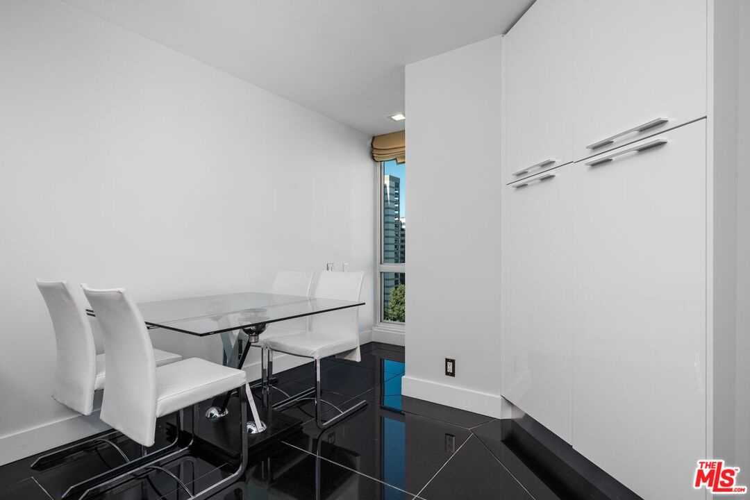 10490 Wilshire Boulevard, Unit 1004 Los Angeles, CA 90024 - Photo 20 of 45 a view of a dining room with furniture