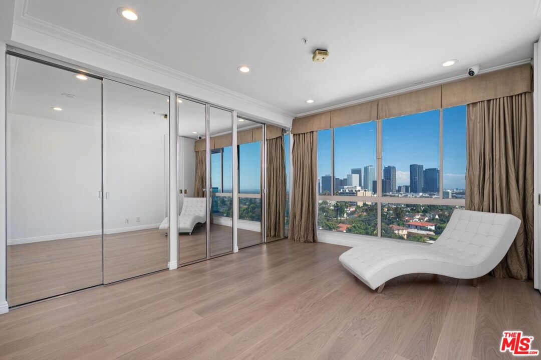 10490 Wilshire Boulevard, Unit 1004 Los Angeles, CA 90024 - Photo 34 of 45 a living room with furniture and a wooden floor