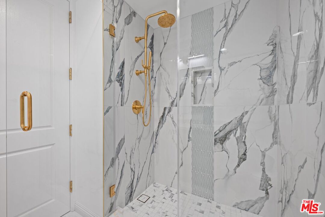 10490 Wilshire Boulevard, Unit 1004 Los Angeles, CA 90024 - Photo 37 of 45 a bathroom with a shower