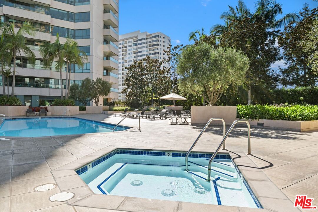 10490 Wilshire Boulevard, Unit 1004 Los Angeles, CA 90024 - Photo 41 of 45 a swimming pool with outdoor seating and yard