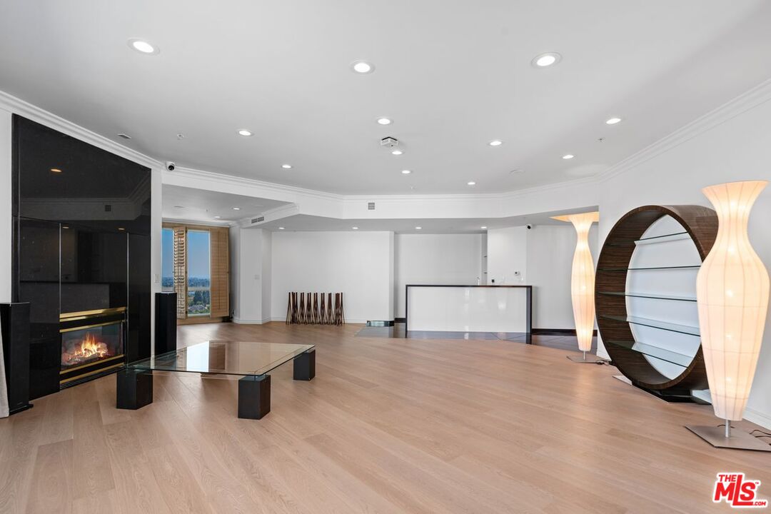 10490 Wilshire Boulevard, Unit 1004 Los Angeles, CA 90024 - Photo 7 of 45 a view of living room filled with furniture and window