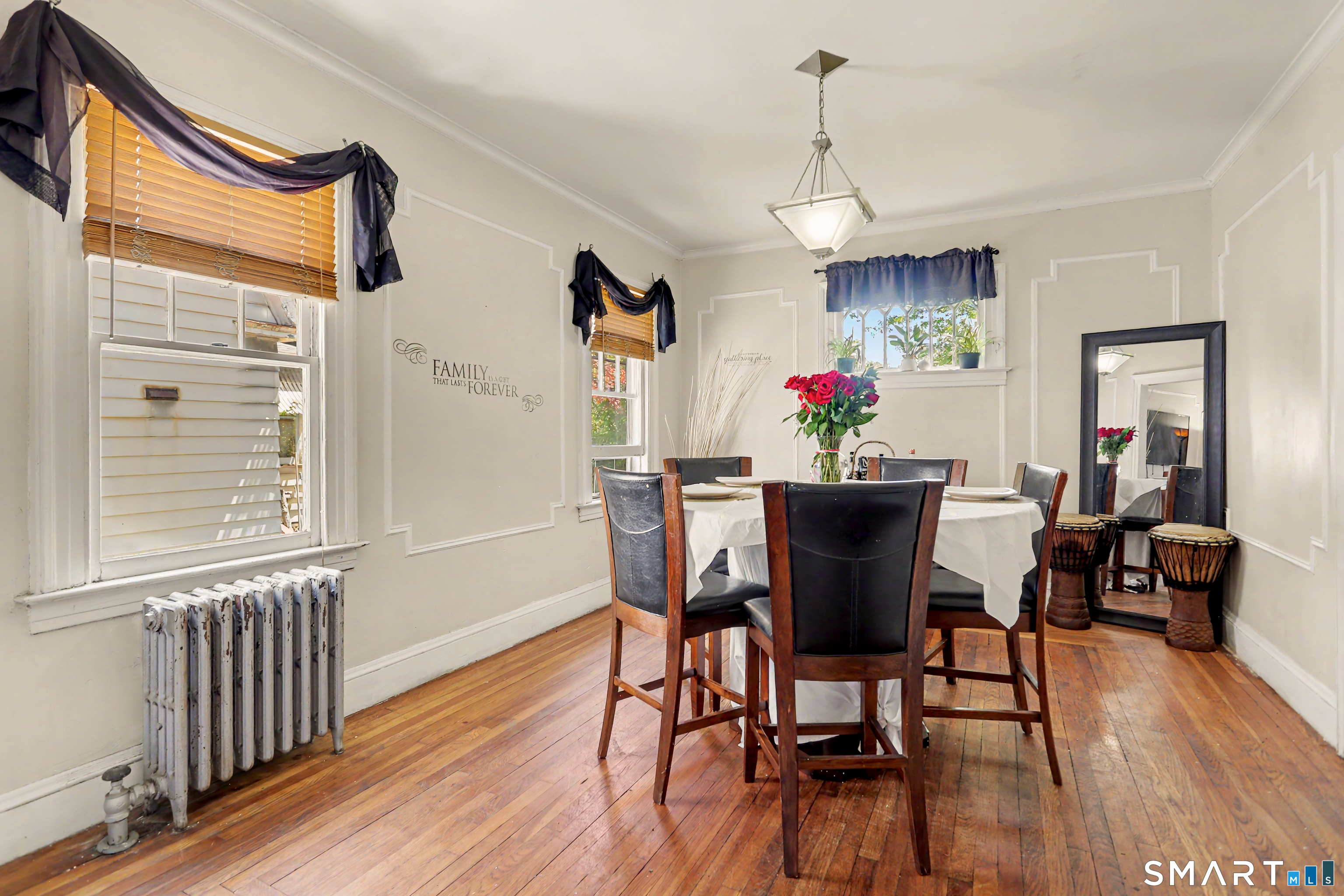 94 2nd Street Hamden, CT 06514 - Photo 9 of 31 a view of a dining room with furniture window and wooden floor