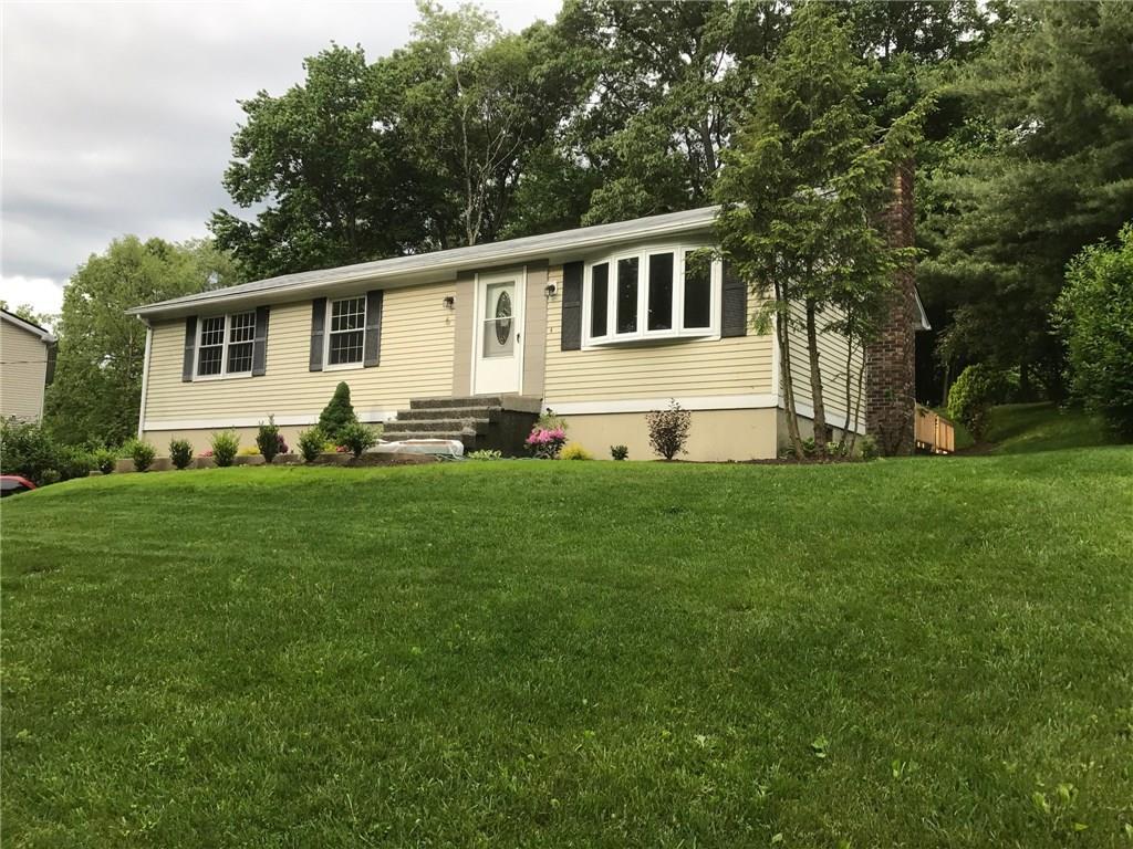 6 McKay Road Danbury, CT 06811 - Photo 1 of 1 a front view of house with yard and green space