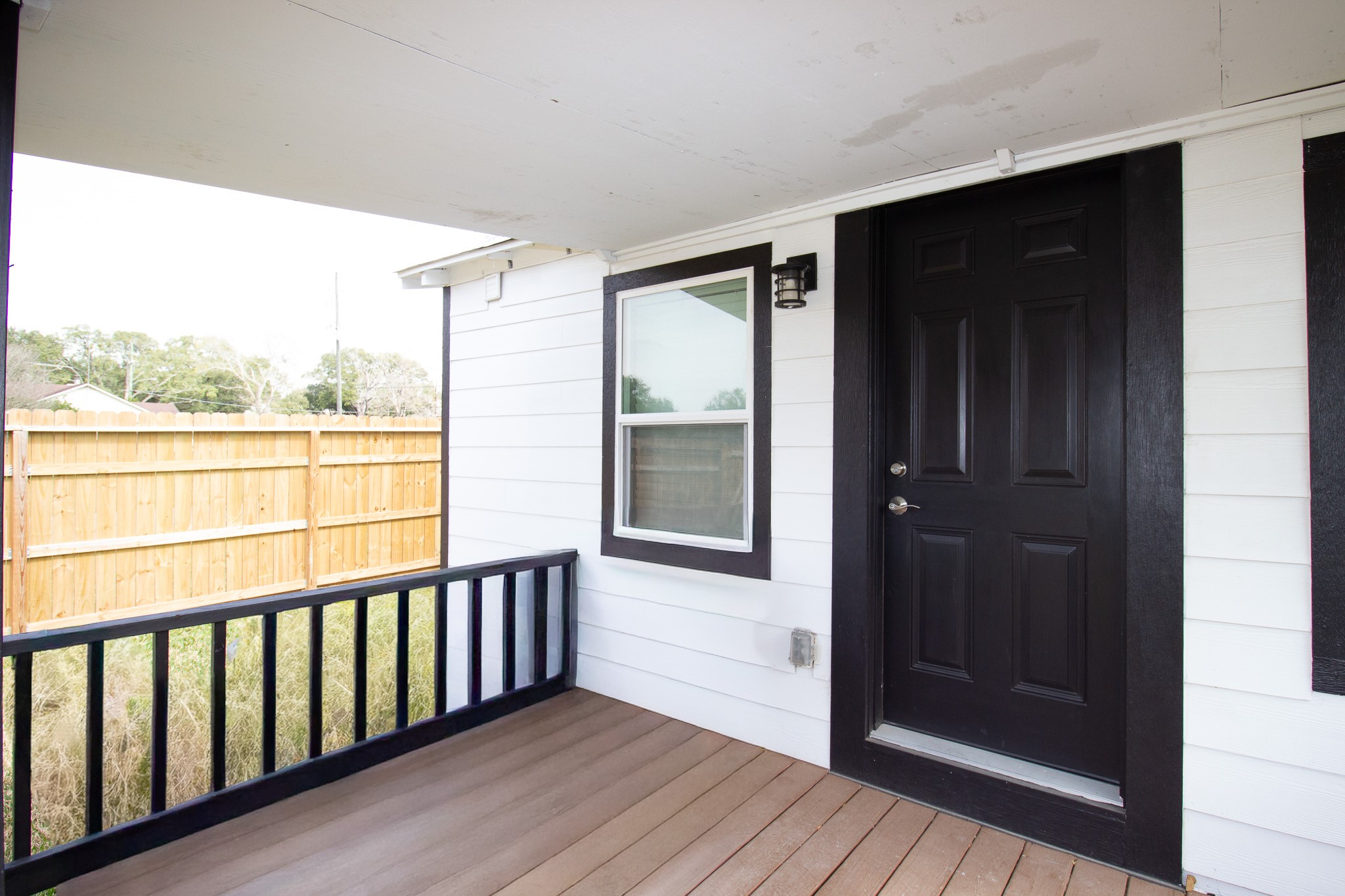 1819 Key Street Waller, TX 77484 - Photo 15 of 19 a view of a balcony with wooden floor and outdoor space