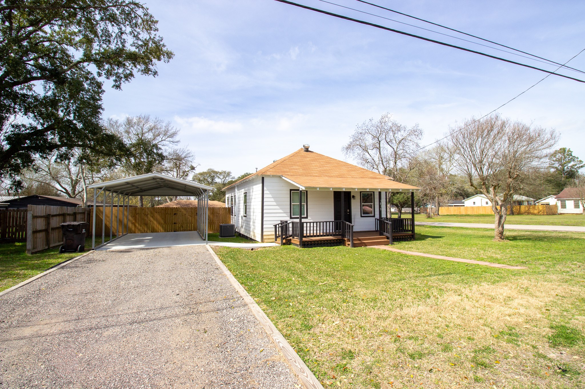 1819 Key Street Waller, TX 77484 - Photo 2 of 19 a front view of a house with a yard and garage