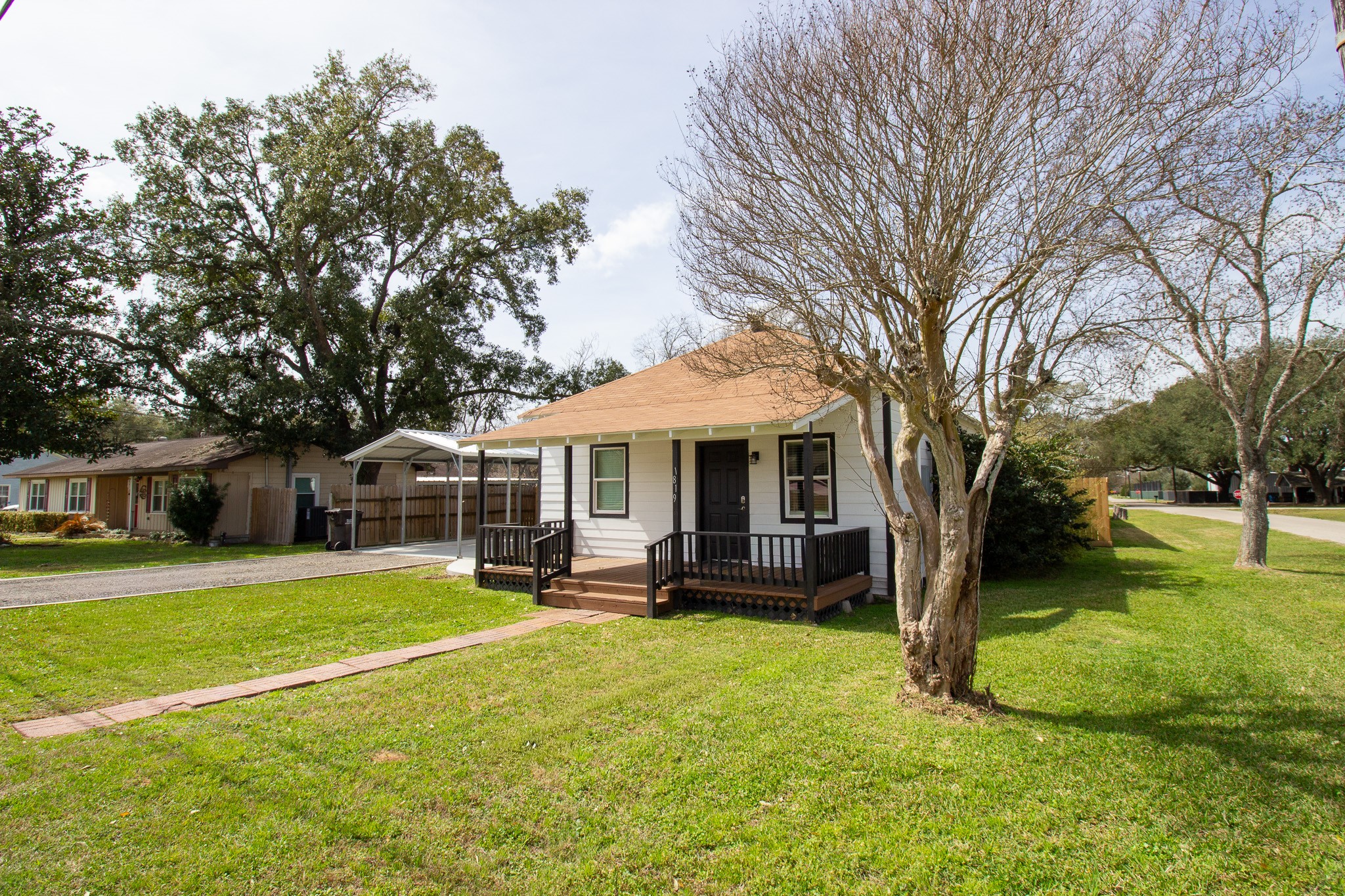 1819 Key Street Waller, TX 77484 - Photo 3 of 19 a view of a house with a big yard and large trees