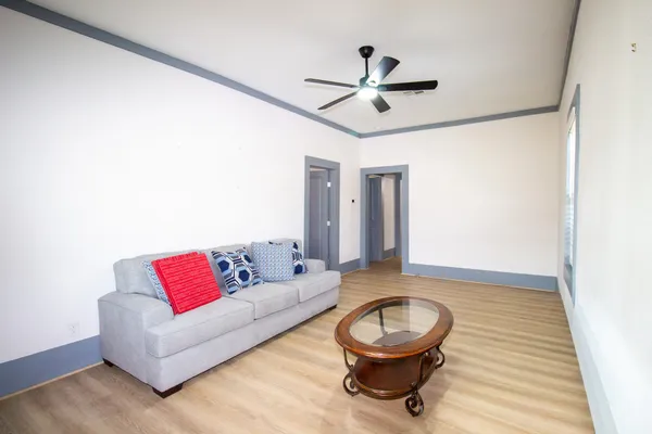 a living room with furniture and a rug