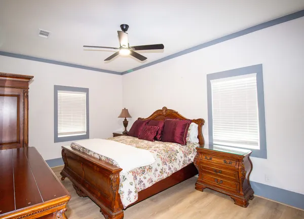 a bedroom with a bed and window