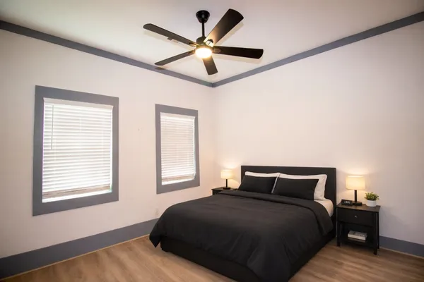 a bedroom with a bed and window