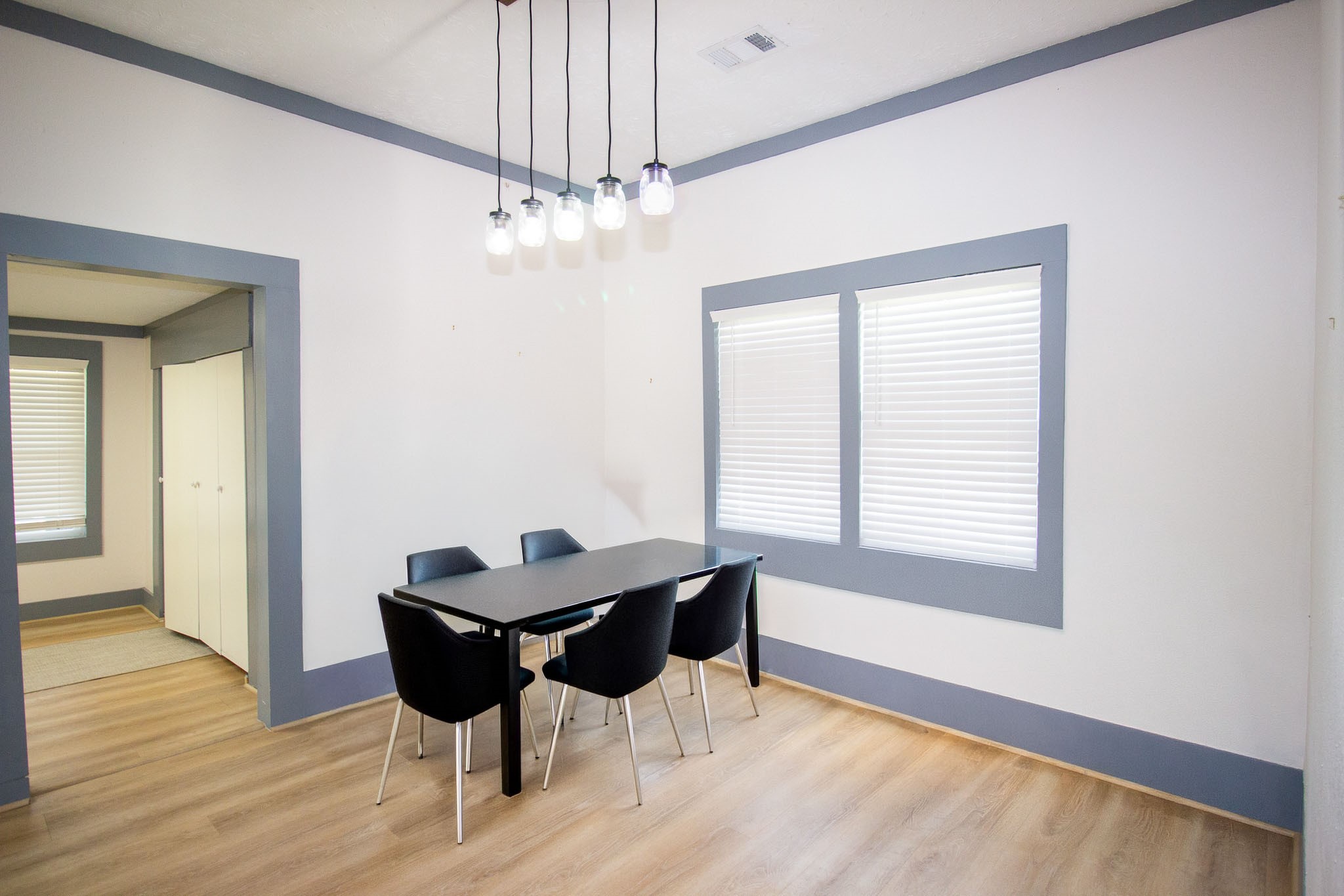 1819 Key Street Waller, TX 77484 - Photo 9 of 19 a dining room with chandelier and wooden floor