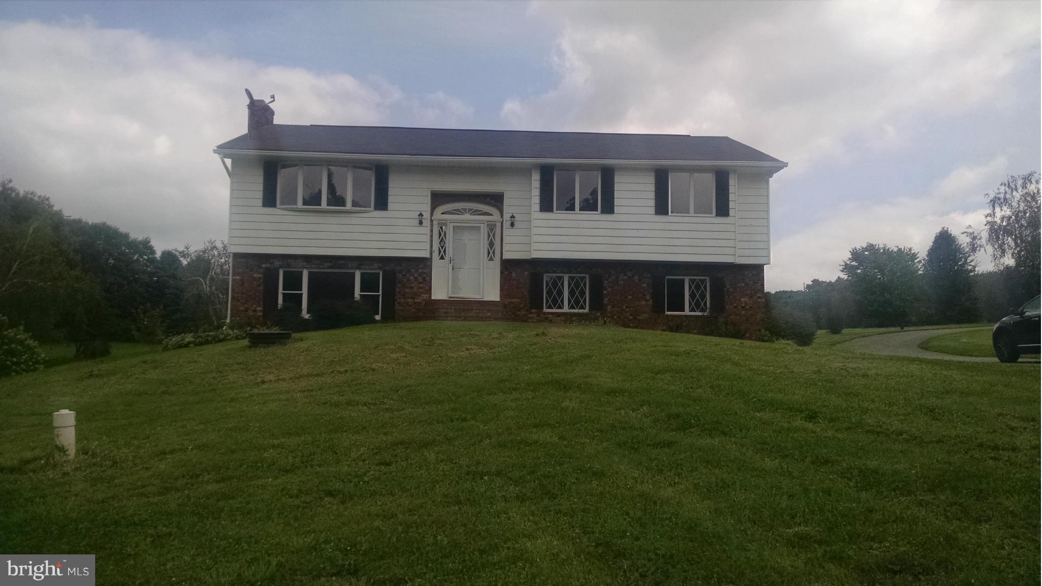 3493 Salem Bottom Road Westminster, MD 21157 - Photo 1 of 30 a front view of a house with a garden