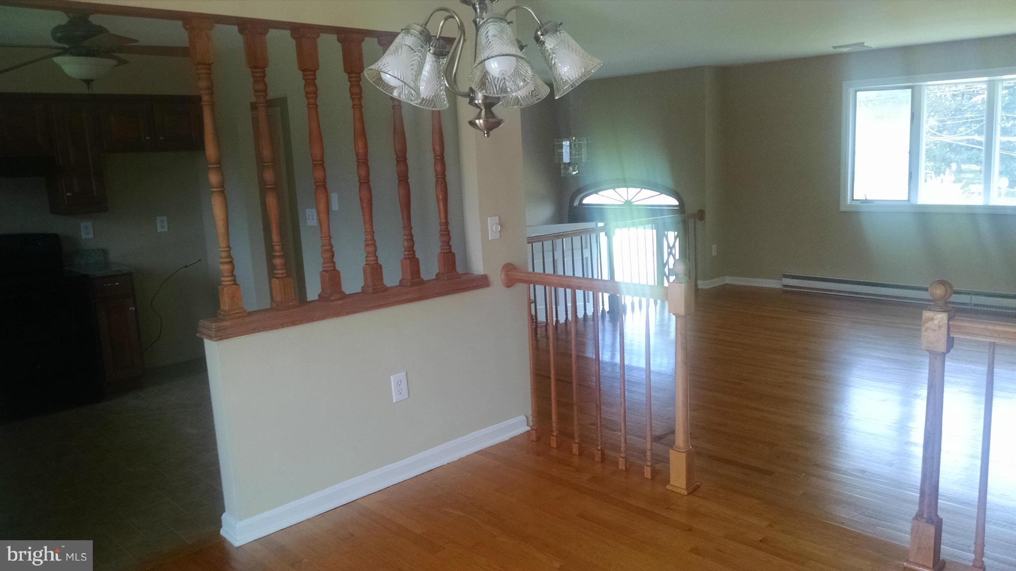 3493 Salem Bottom Road Westminster, MD 21157 - Photo 12 of 30 a view of a livingroom with wooden floor