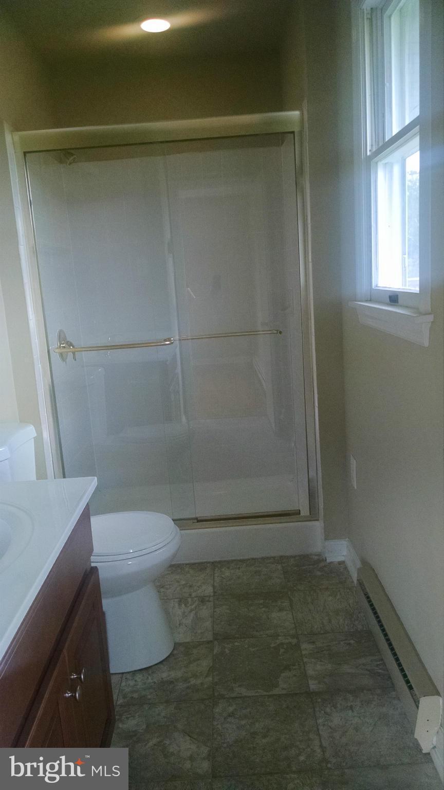 3493 Salem Bottom Road Westminster, MD 21157 - Photo 18 of 30 a bathroom with a toilet and a shower