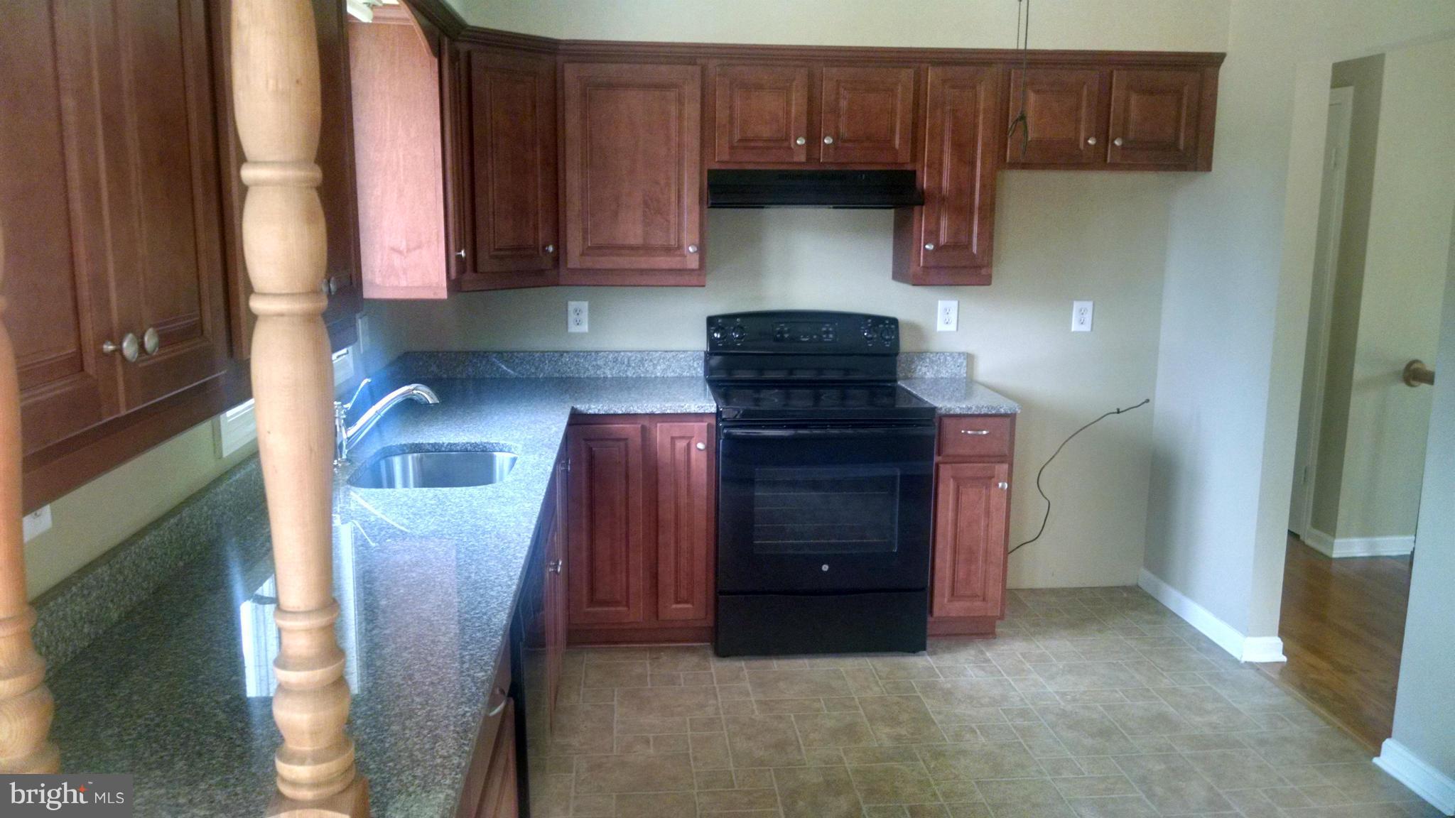 3493 Salem Bottom Road Westminster, MD 21157 - Photo 9 of 30 a kitchen with a stove and a refrigerator