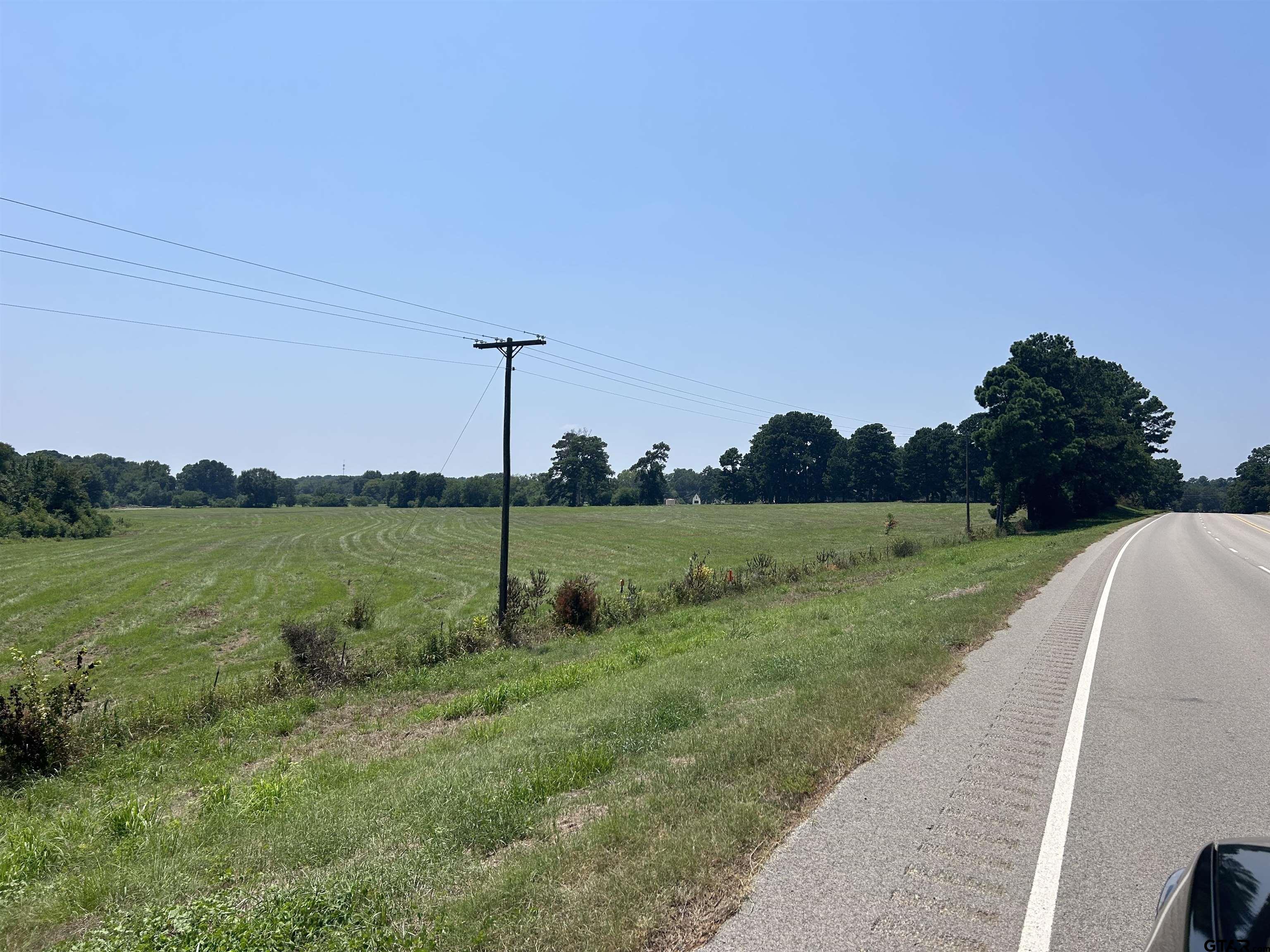 22173 Highway 135 Troup, TX 75789 - Photo 10 of 23 a view of a green field with wooden fence