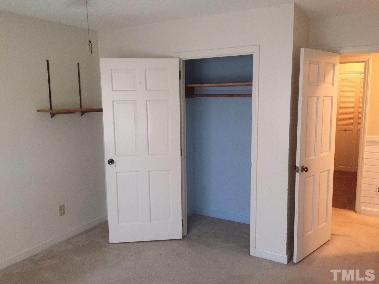 1088 Glover Road Dunn, NC 28334 - Photo 17 of 24 a view of an empty room with closet and a window