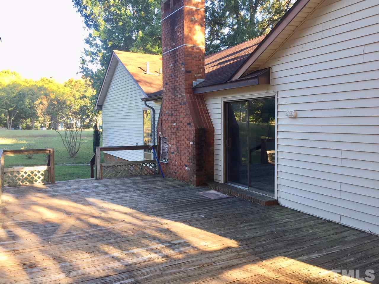 1088 Glover Road Dunn, NC 28334 - Photo 3 of 24 a view of a house with a patio