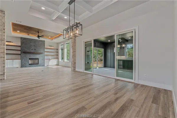 a kitchen with stainless steel appliances granite countertop a stove and a refrigerator