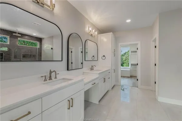 a bathroom with a bathtub and shower