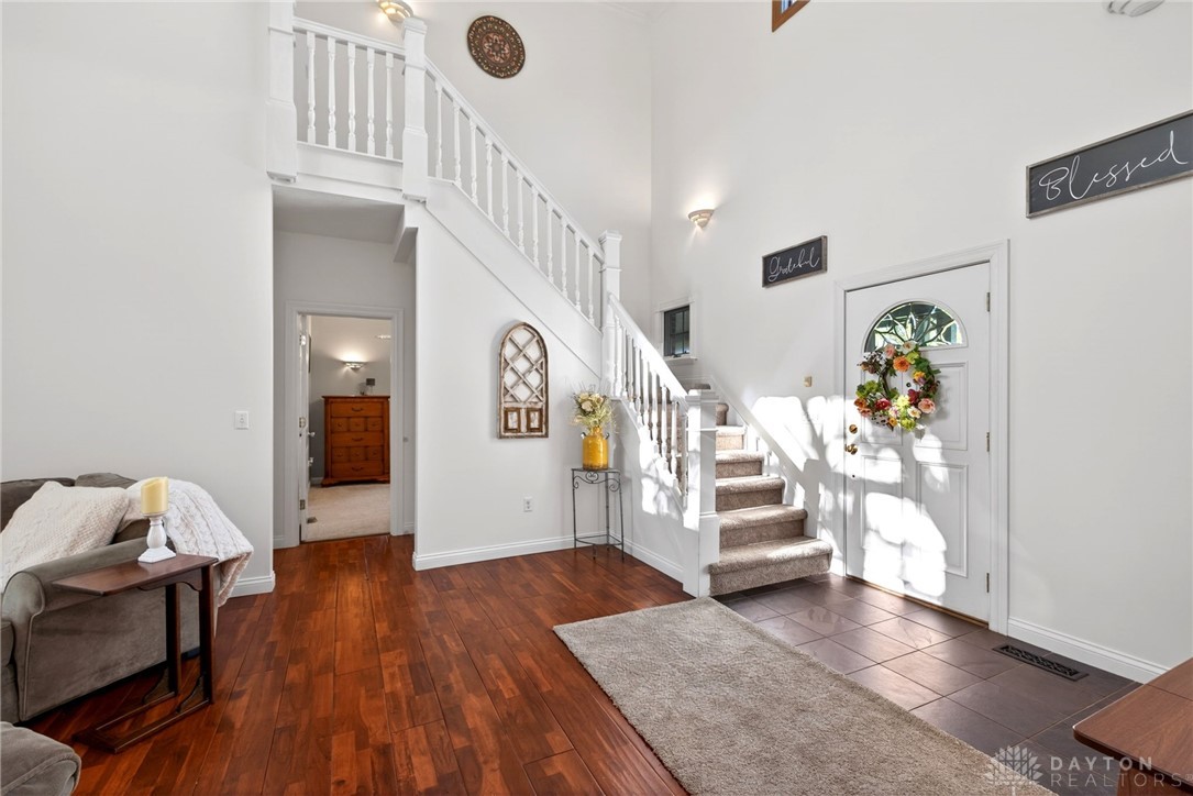 330 South Alpha Bellbrook Road Bellbrook, OH 45305 - Photo 11 of 87 This bright entry offers a welcoming ambiance, leading to elegant stairs and rich hardwood floors.
