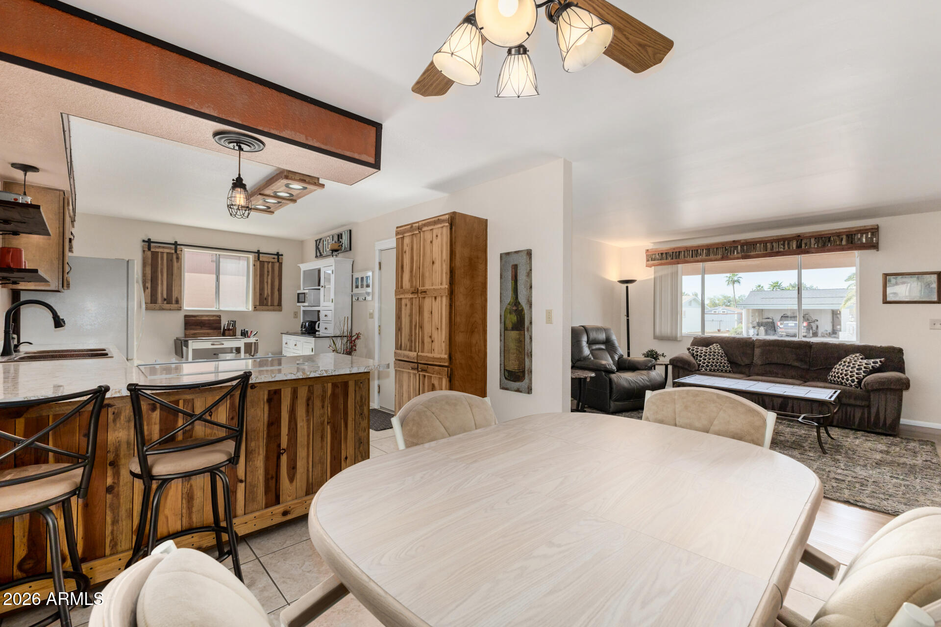 1379 South Main Drive Apache Junction, AZ 85120 - Photo 11 of 32 a large bedroom with bed and a chandelier