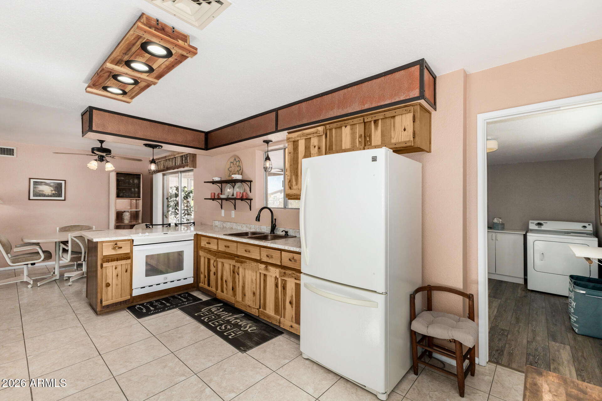 1379 South Main Drive Apache Junction, AZ 85120 - Photo 13 of 32 a white refrigerator freezer sitting inside of a kitchen