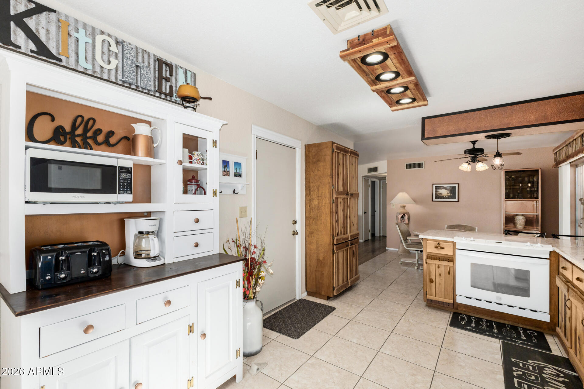 1379 South Main Drive Apache Junction, AZ 85120 - Photo 14 of 32 a kitchen with stainless steel appliances granite countertop a refrigerator and a stove top oven