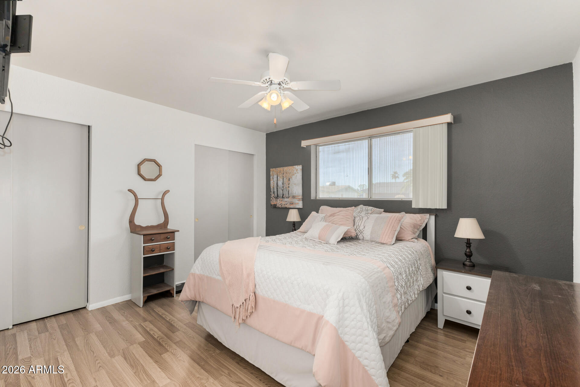 1379 South Main Drive Apache Junction, AZ 85120 - Photo 16 of 32 a bedroom with a bed and a chandelier