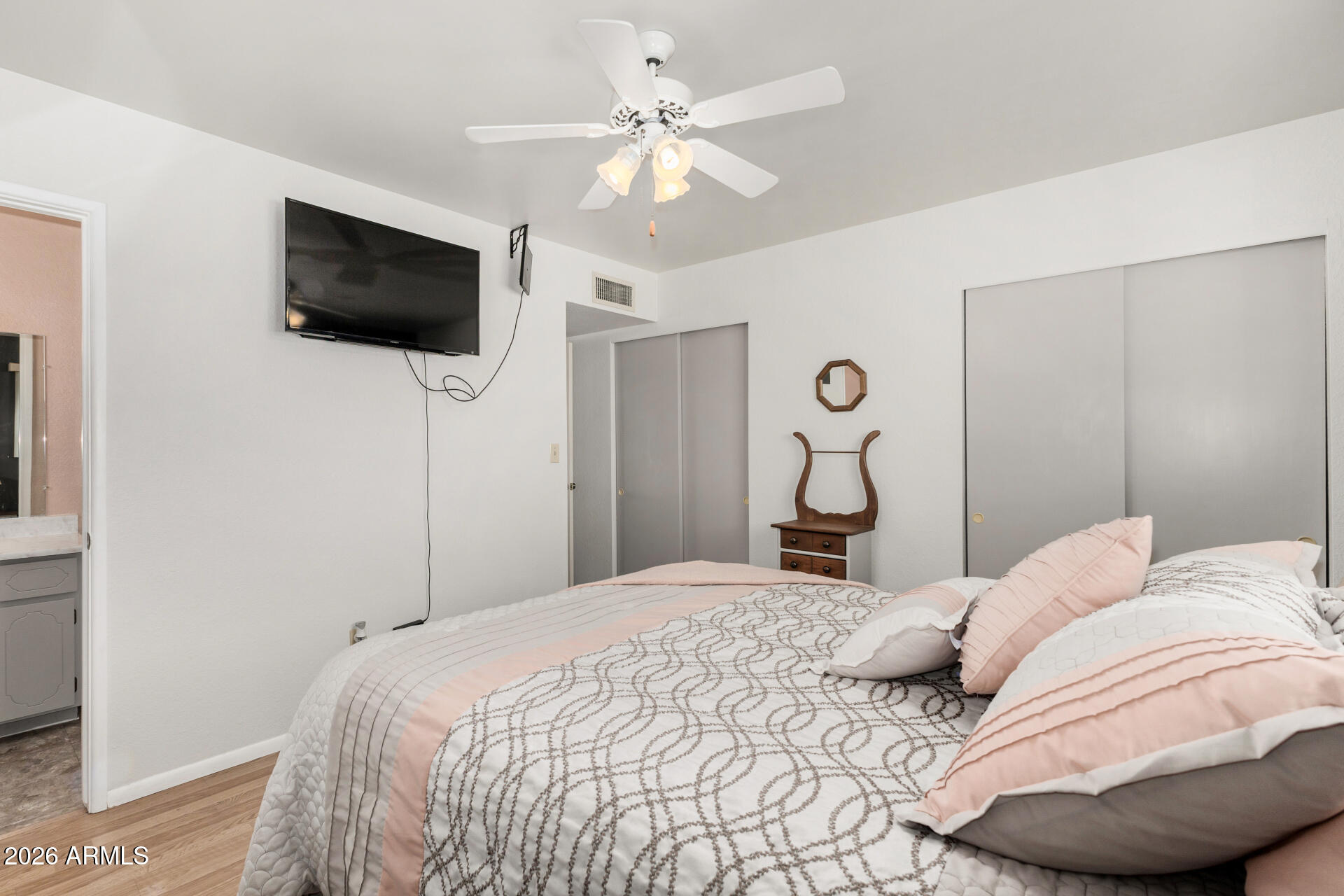 1379 South Main Drive Apache Junction, AZ 85120 - Photo 17 of 32 a bedroom with a bed and a flat screen tv