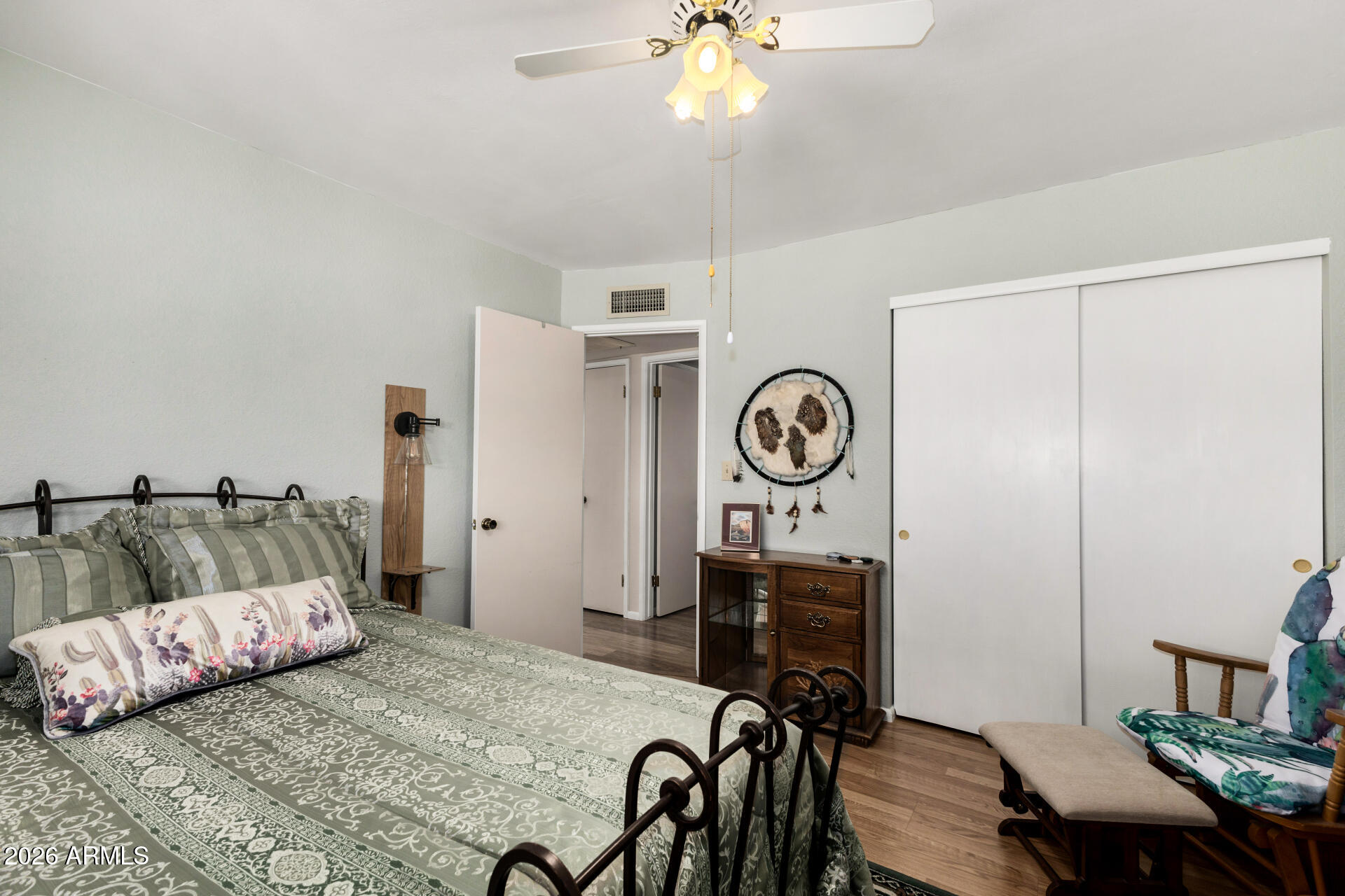 1379 South Main Drive Apache Junction, AZ 85120 - Photo 20 of 32 a bedroom with a bed and a chandelier