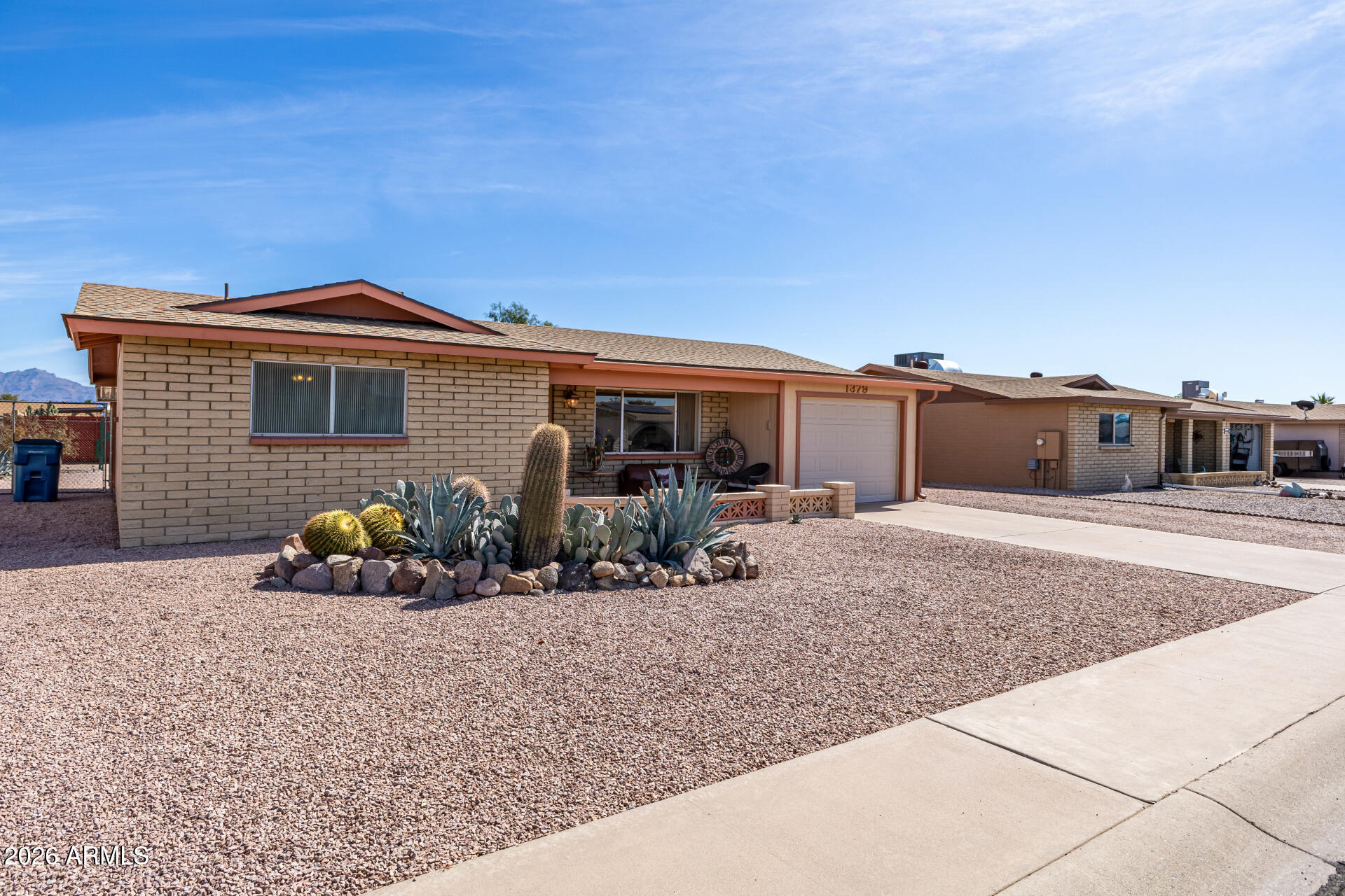 1379 South Main Drive Apache Junction, AZ 85120 - Photo 3 of 32 a front view of a house with patio
