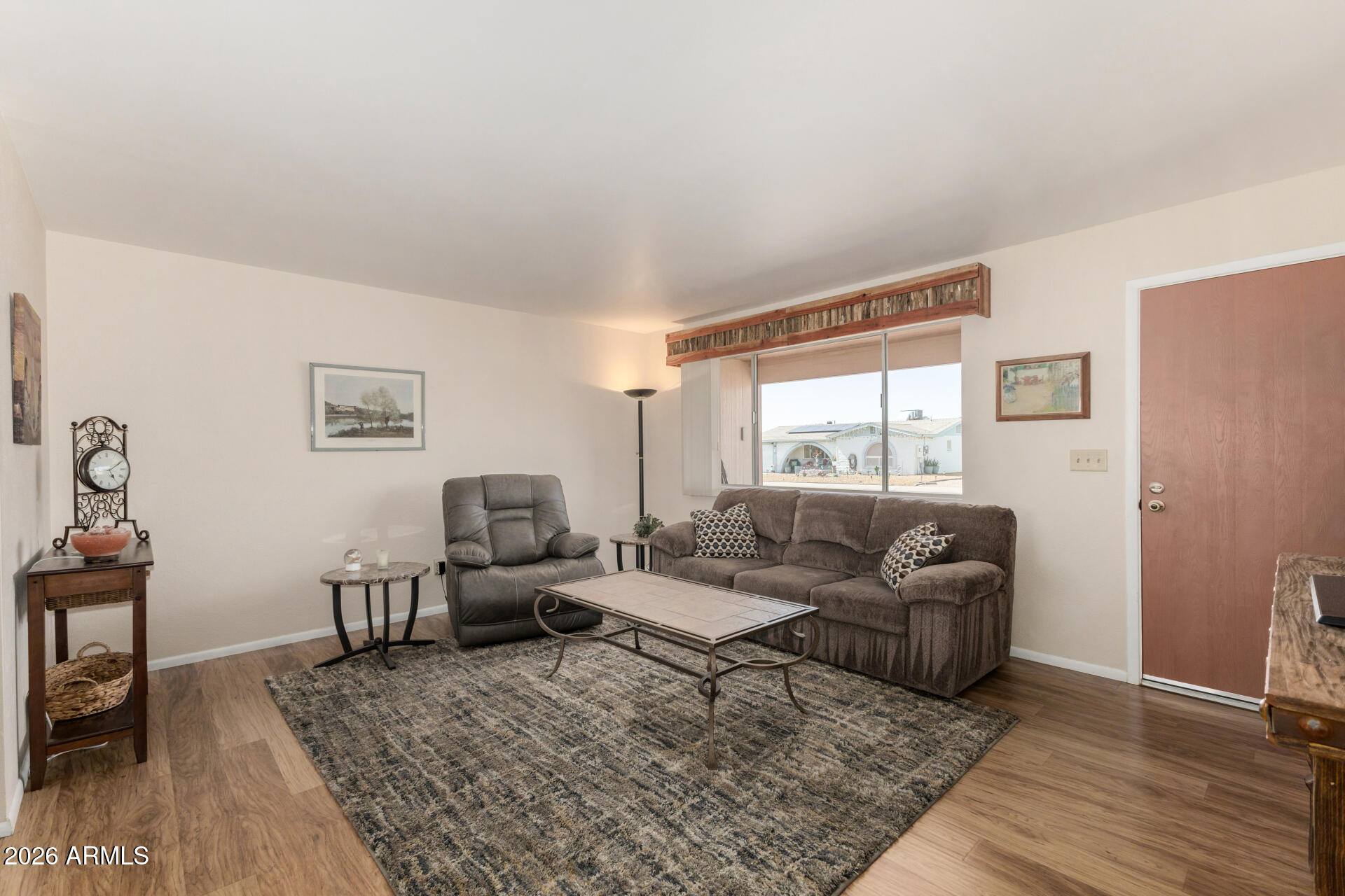 1379 South Main Drive Apache Junction, AZ 85120 - Photo 5 of 32 a living room with furniture and a window