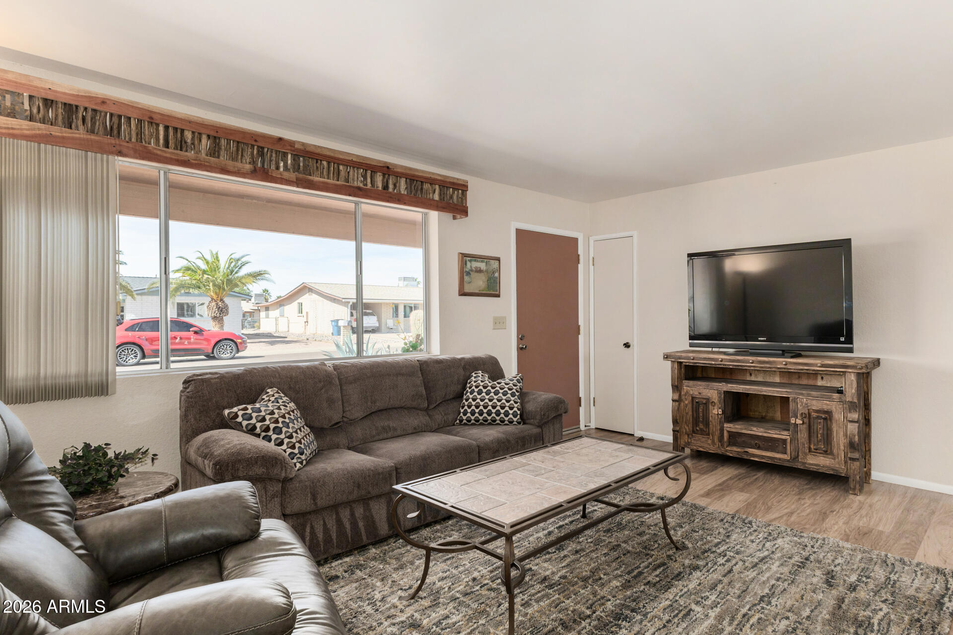 1379 South Main Drive Apache Junction, AZ 85120 - Photo 6 of 32 a living room with furniture and a flat screen tv