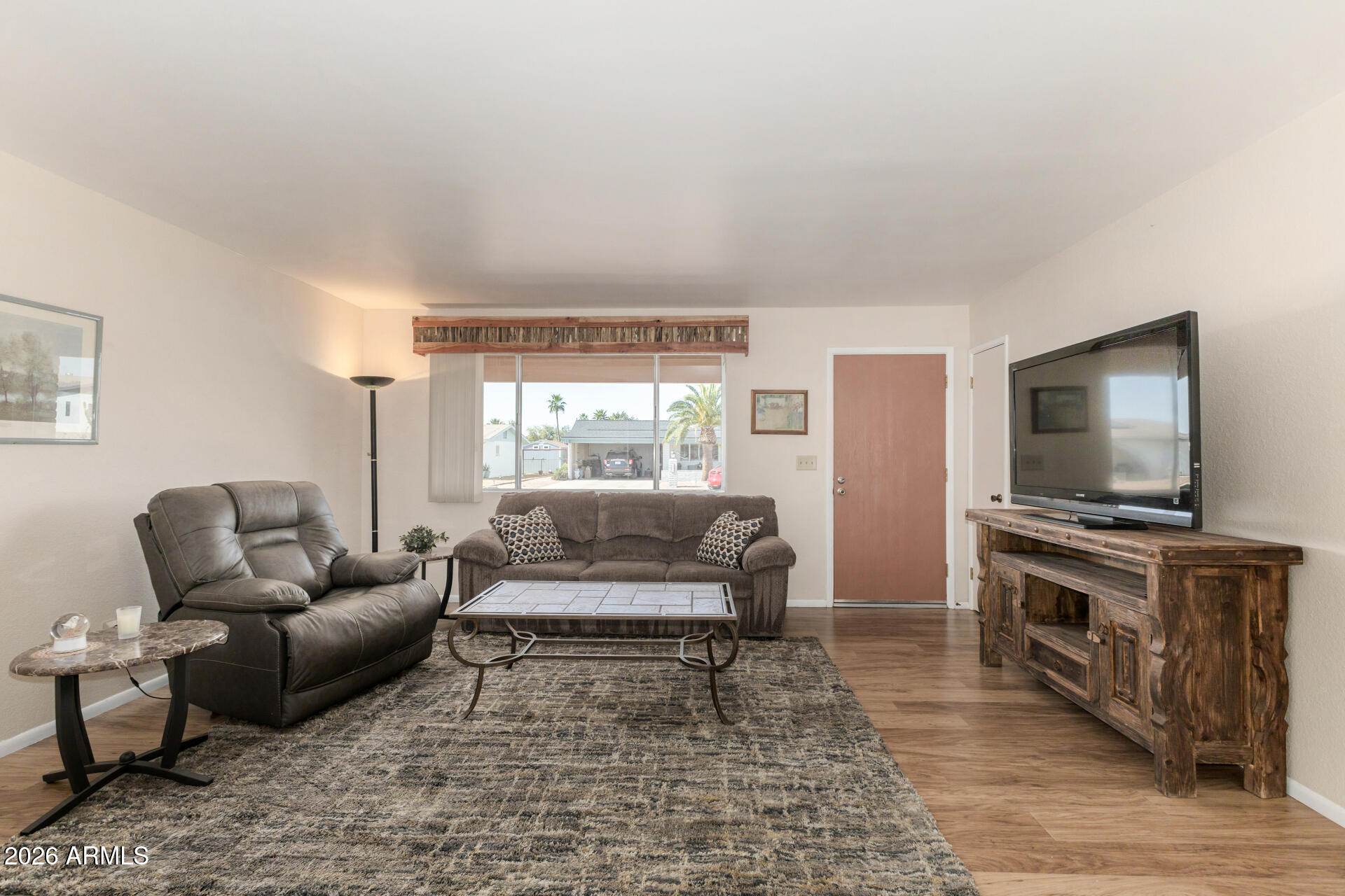 1379 South Main Drive Apache Junction, AZ 85120 - Photo 7 of 32 a living room with furniture and a flat screen tv