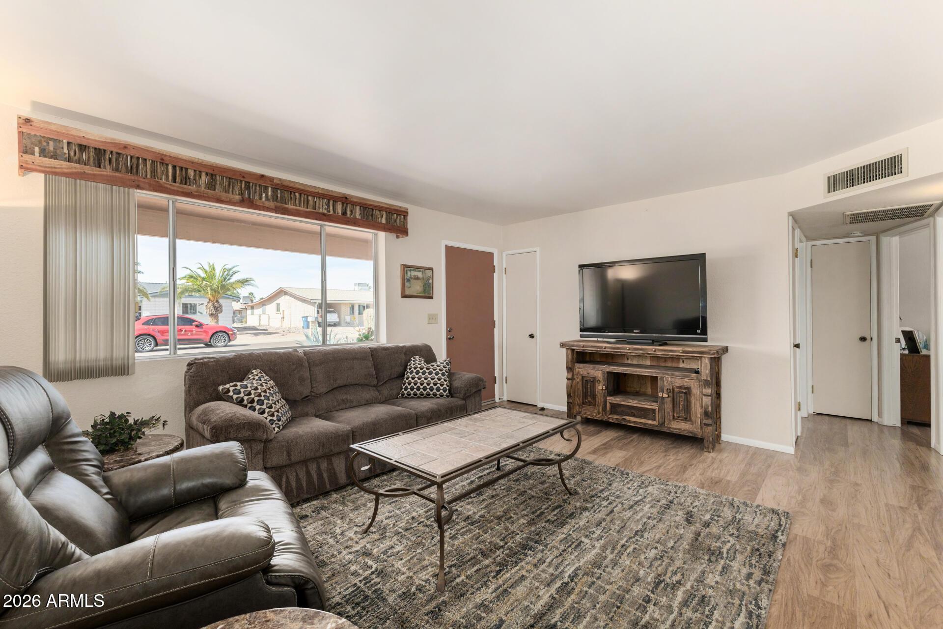 1379 South Main Drive Apache Junction, AZ 85120 - Photo 8 of 32 a living room with furniture and a flat screen tv