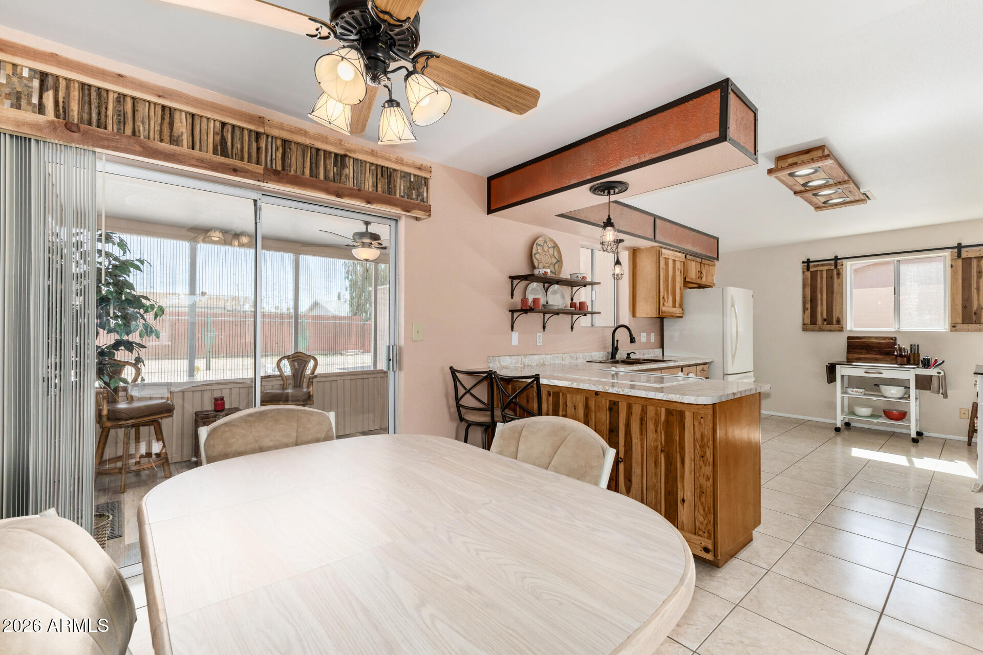 1379 South Main Drive Apache Junction, AZ 85120 - Photo 10 of 32 a spacious bedroom with a large bed and a chandelier
