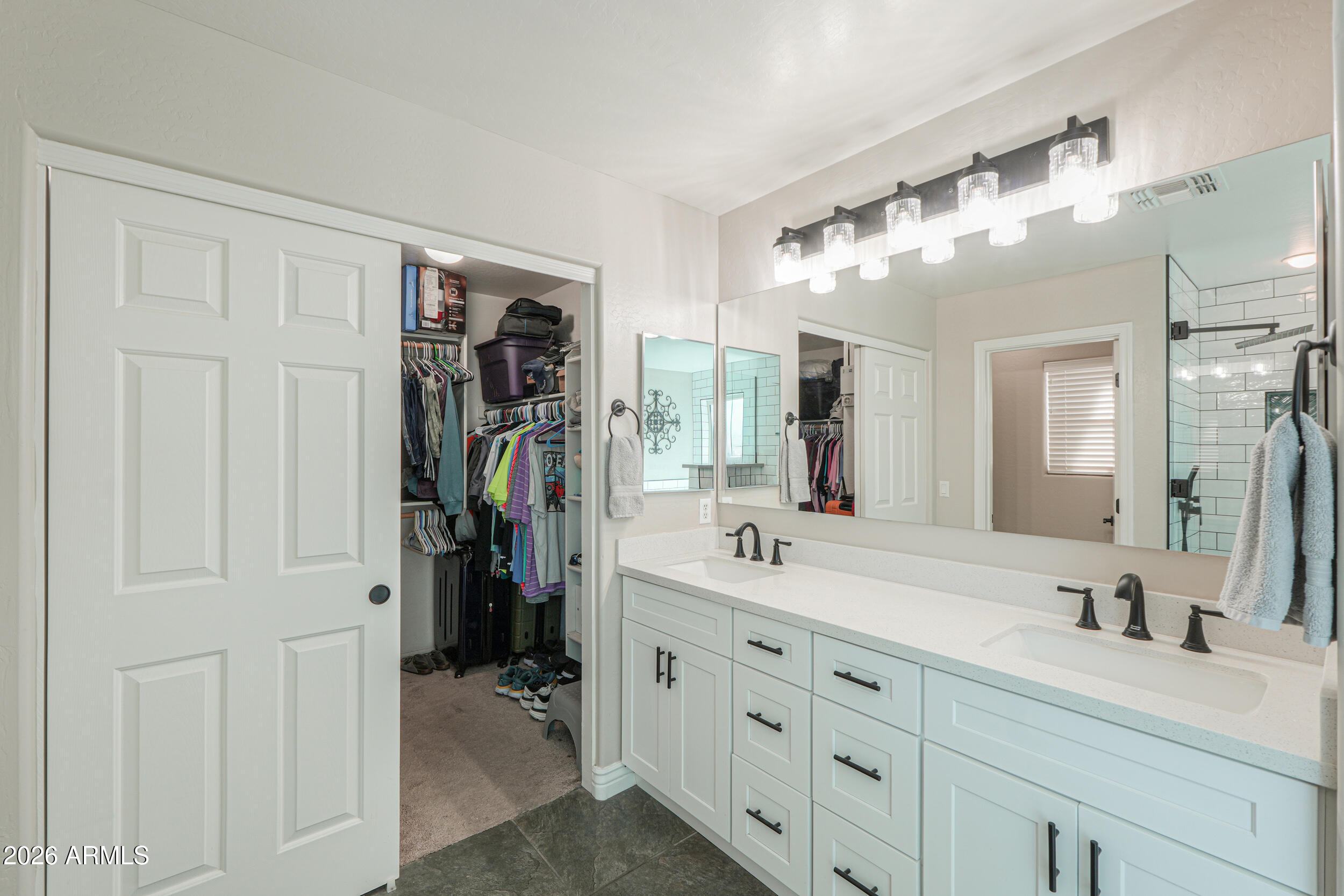 43843 Roth Road Maricopa, AZ 85138 - Photo 38 of 53 a bathroom with a double vanity sink and a mirror
