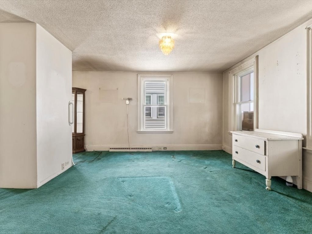 41 Sargent Street Winthrop, MA 02152 - Photo 13 of 40 a view of an empty room with window and cabinet