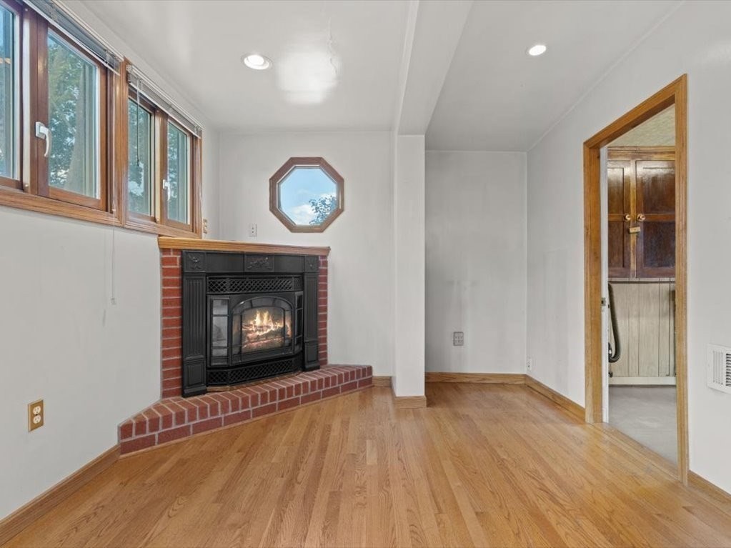 41 Sargent Street Winthrop, MA 02152 - Photo 21 of 40 a view of an empty room with wooden floor and a window