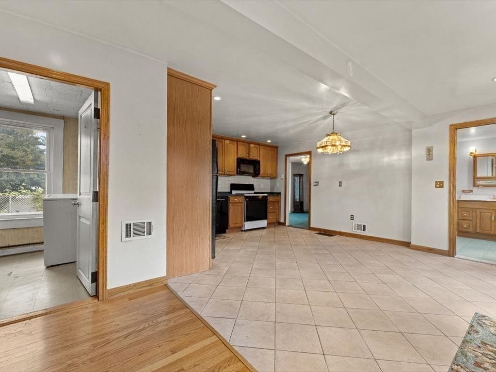 41 Sargent Street Winthrop, MA 02152 - Photo 22 of 40 a view of a kitchen with a sink and a refrigerator