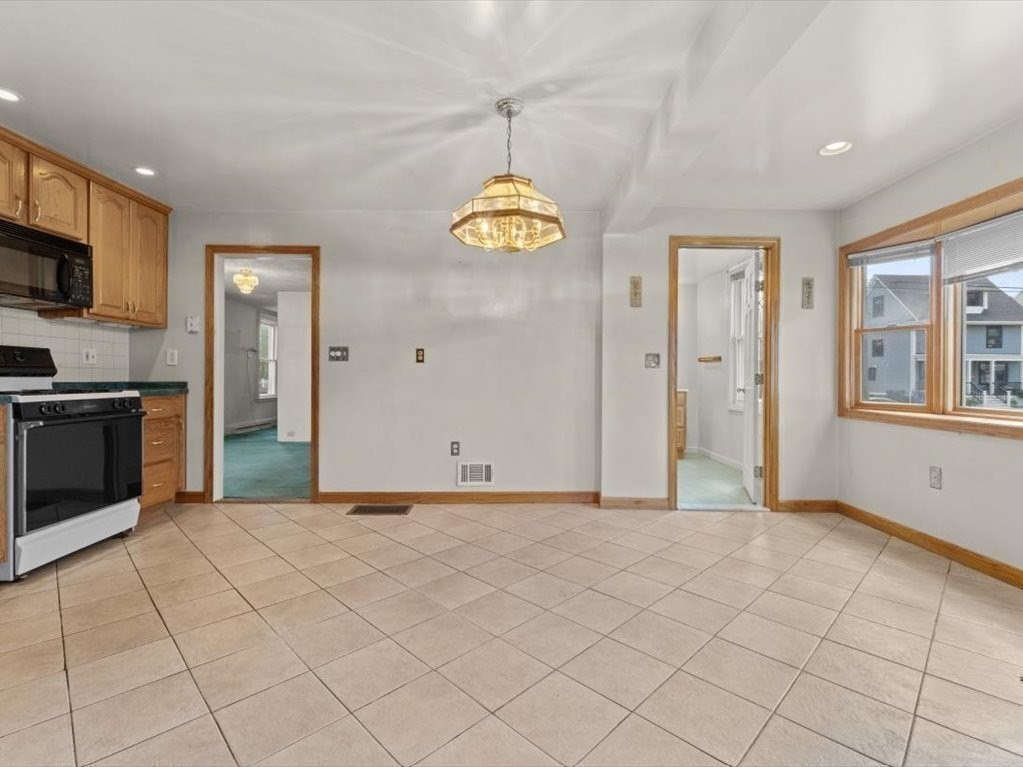 41 Sargent Street Winthrop, MA 02152 - Photo 26 of 40 a view of a kitchen with microwave and cabinets