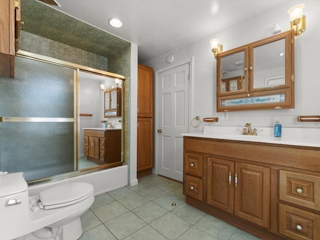 41 Sargent Street Winthrop, MA 02152 - Photo 28 of 40 a spacious bathroom with a shower sink and mirror